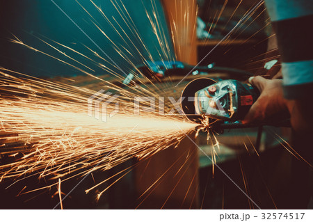 Sparks during cutting of metal angle grinder. Sparks during cutting of metal angle grinder. 32574517