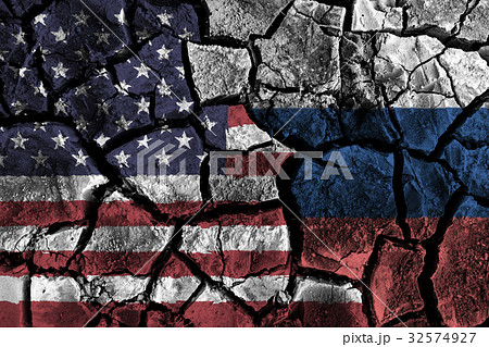 America and Russia flag on cracked ground . America and Russia flag on cracked ground . 32574927