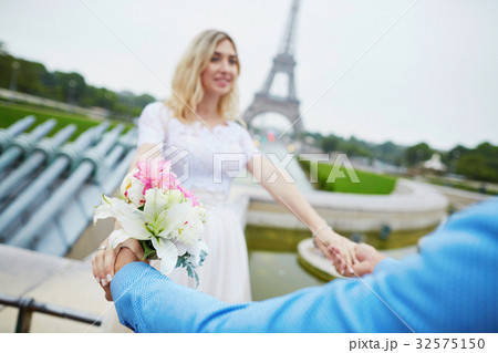 Just married couple near the Eiffel tower in Paris Just married couple near the Eiffel tower in Paris 32575150