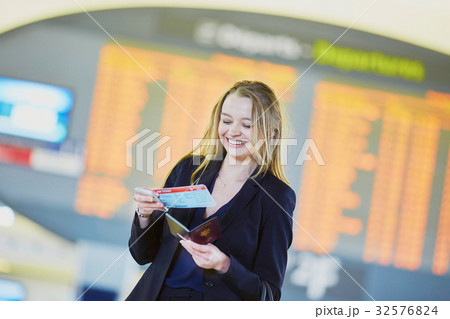Young business woman in international airport Young business woman in international airport 32576824