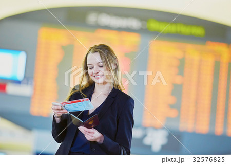 Business woman with boarding pass and passport in international airport 32576825