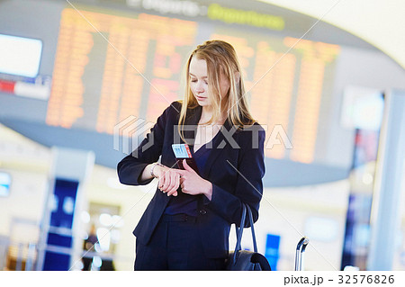 Young business woman in international airport Young business woman in international airport 32576826