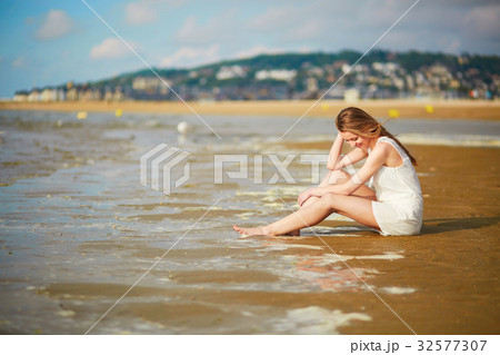 Woman enjoying her vacation by ocean or sea 32577307