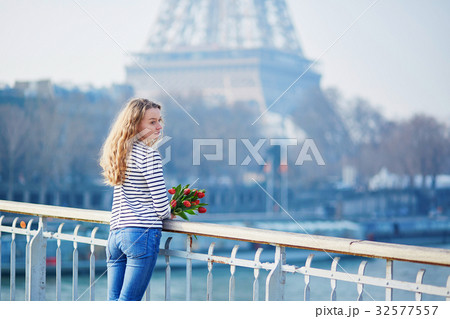 Beautiful young girl outdoors near the Eiffel tower 32577557