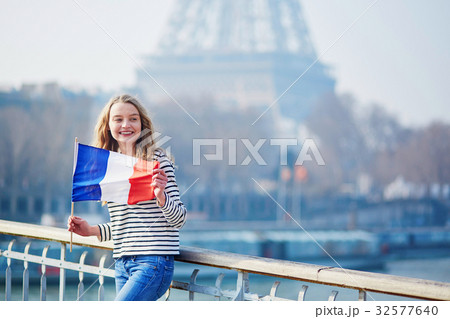 Beautiful young girl with French national flag 32577640