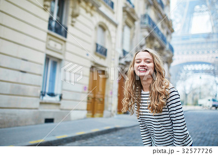 Girl outdoors near the Eiffel tower, in Paris 32577726