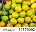 Fruit stall selling tangerine or orange fruit. 32579092