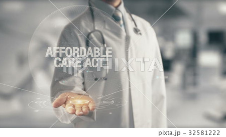 Doctor holding in hand Affordable Care Act 32581222
