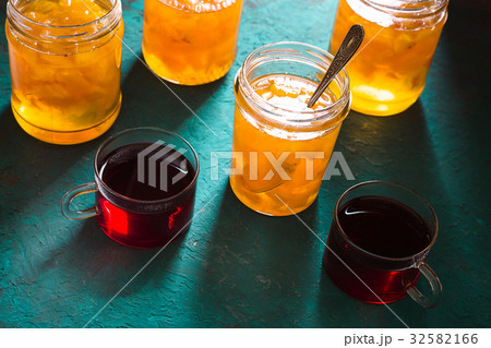 Banks with pineapple jam and tea on the table 32582166