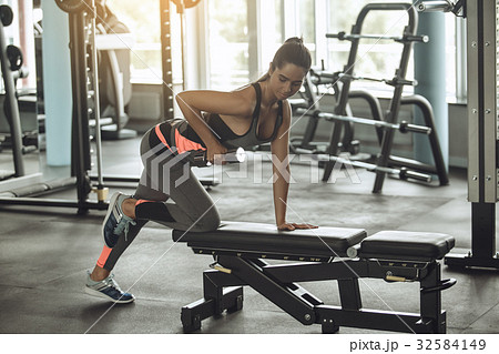 Young woman exercise in the gym healthy lifestyle Young woman exercise in the gym healthy lifestyle 32584149
