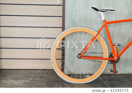 orange bicycle parked decorate interior 32593775