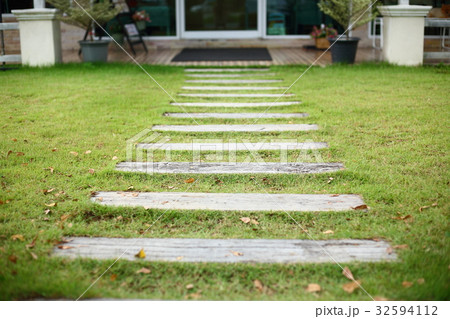 concrete pathway pavement step on green grass 32594112