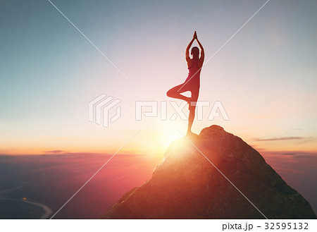 Woman practices yoga 32595132