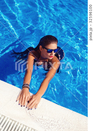 Beautiful girl in outdoor pool Beautiful girl in outdoor pool 32596100