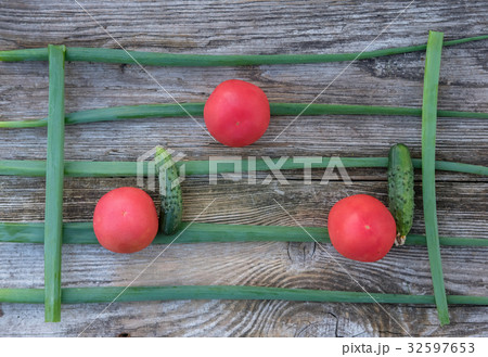 Tomatoes, onion and cucumbers on the Board 32597653