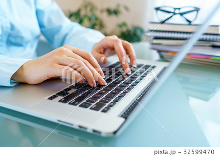 Closeup female hands on laptop keyboard 32599470