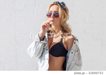 Young sexy woman with lollipop in her mouth 32600752
