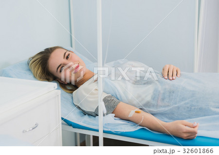 Woman Lying Down In Hospital Bed and smiling. Woman Lying Down In Hospital Bed and smiling. 32601866