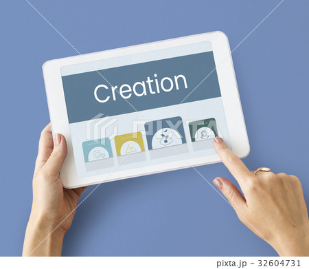 Hands working on digital device network graphic overlay Hands working on digital device network graphic overlay 32604731