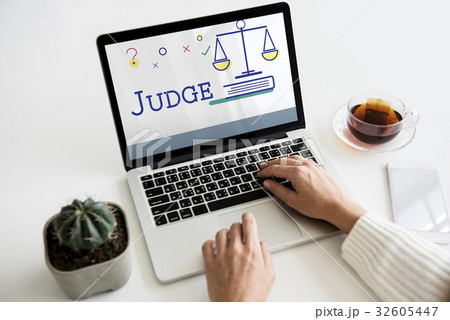Hands using laptop with scale icon and legal court word concept 32605447