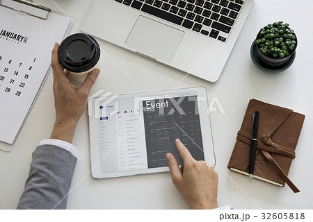 Business people checking appointment on personal organizer schedule Business people checking appointment on personal organizer schedule 32605818