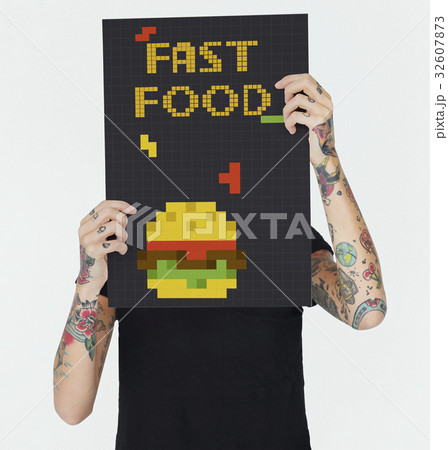 Woman holding banner of 8 bit illustration of tasty burger meal Woman holding banner of 8 bit illustration of tasty burger meal 32607873