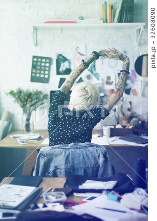 Fashion designer tattooed girl stretching 32608090