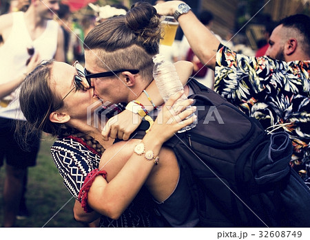 Woman Kissing Man in Live Music Concert Festival Woman Kissing Man in Live Music Concert Festival 32608749