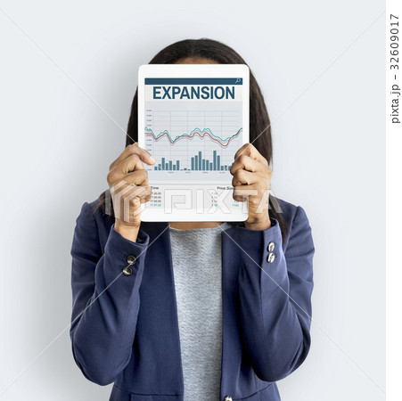 Woman holding network graphic overlay digital device covering face Woman holding network graphic overlay digital device covering face 32609017