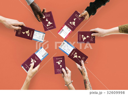 Group of hands holding passport in aerial view 32609998
