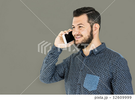 Man standing and using phone to pose for photoshoot 32609999