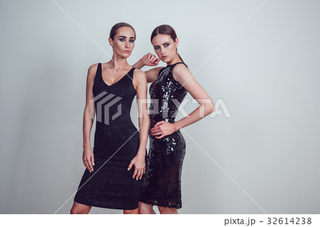 Two beautiful women in black night fashion dress 32614238