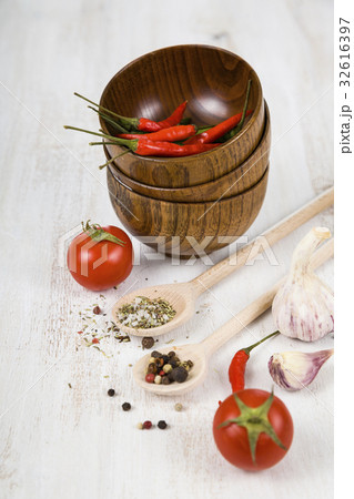 Vegetables and spices in wooden bowls Vegetables and spices in wooden bowls 32616397