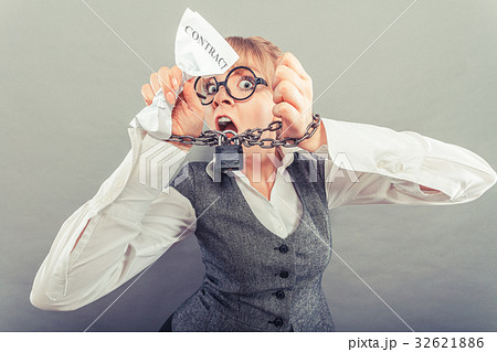 Furious woman with chained hands and contract 32621886