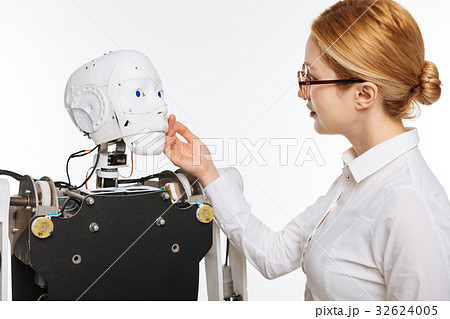 Elegant inspired scientist fascinated by the robot Elegant inspired scientist fascinated by the robot 32624005