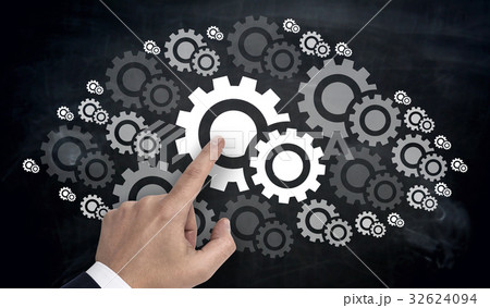 Hand pointing on gearwheel cloud concept 32624094