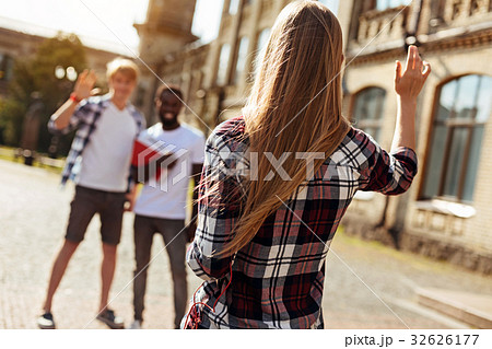 Lovely gorgeous woman greeting her friends Lovely gorgeous woman greeting her friends 32626177