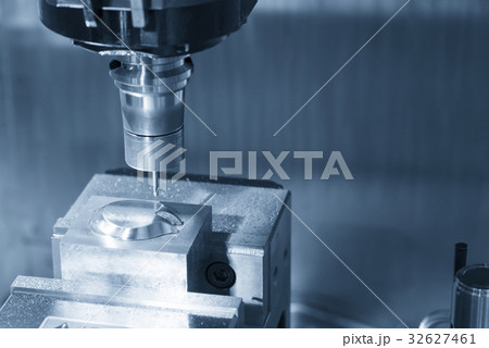 The CNC milling machine cutting the sample part The CNC milling machine cutting the sample part 32627461