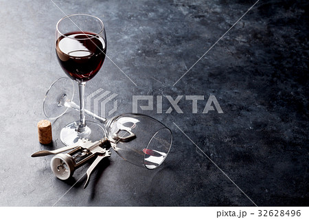 Red wine glasses and corkscrew 32628496