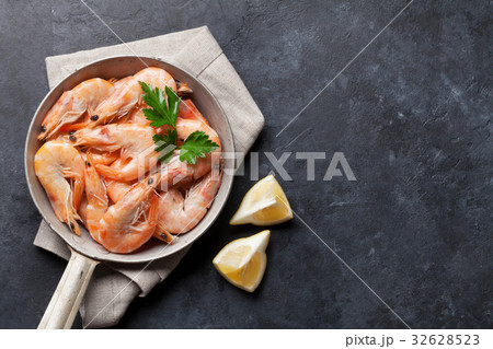 Fresh seafood on stone table. Shrimps 32628523