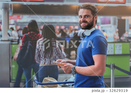 Merry smiling man in terminal 32629319