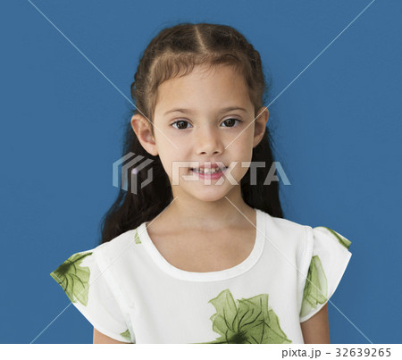 Young little girl with awkward smile expression portrait Young little girl with awkward smile expression portrait 32639265