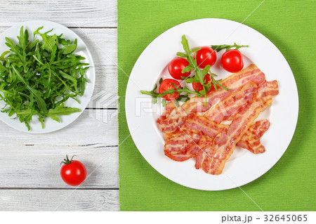 delicious crispy fried bacon slices on plate delicious crispy fried bacon slices on plate 32645065