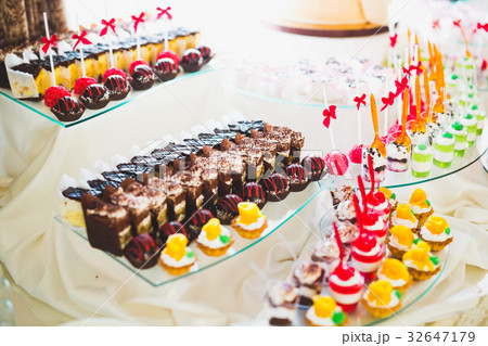 Different kinds of baked sweets on a buffet 32647179