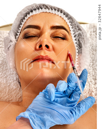 Filler injection female face. Plastic facial 32647944