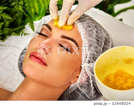 Facial mask from fruits for woman. Girl in medical 32648024