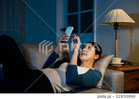 college student using phone chatting online college student using phone chatting online 32650066
