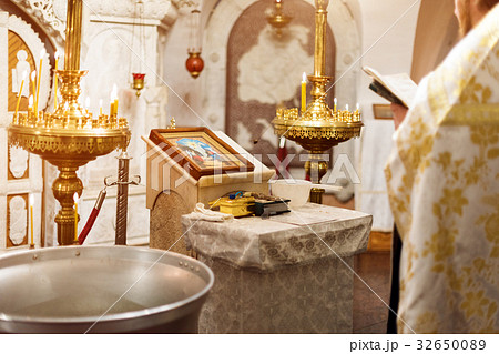 Priest wearing gold robe on ceremony in christian 32650089
