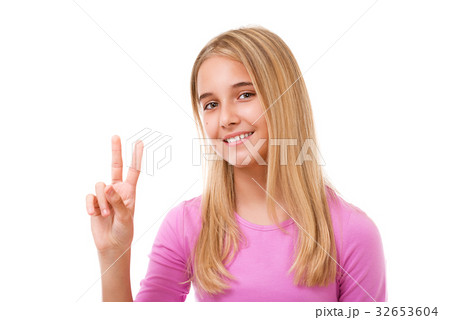 Picture of teen girl showing victory or peace sign Picture of teen girl showing victory or peace sign 32653604