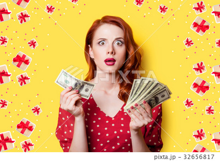 girl in red dress with money 32656817